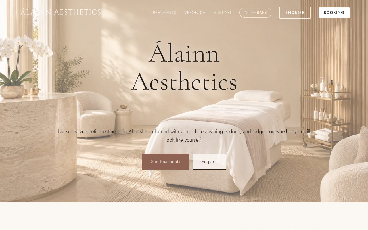 Álainn Aesthetics homepage with a warm neutral treatment room photograph, serif brand wordmark, and See treatments and Enquire buttons