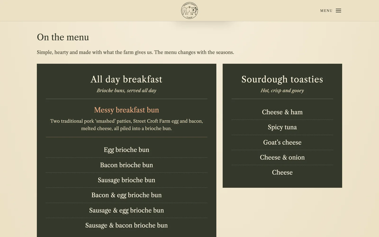 The café menu set as dark panels: an all day breakfast of brioche buns, and sourdough toasties